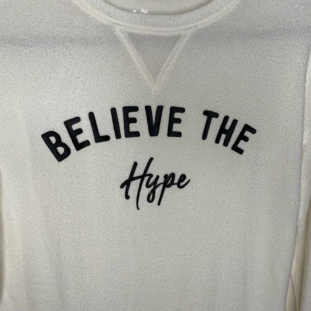 Justice “believe the hype” white fuzzy sweater